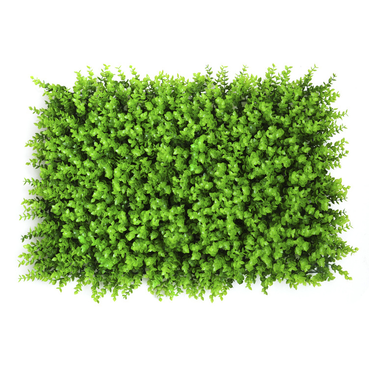 Artificial green grass wall panels background