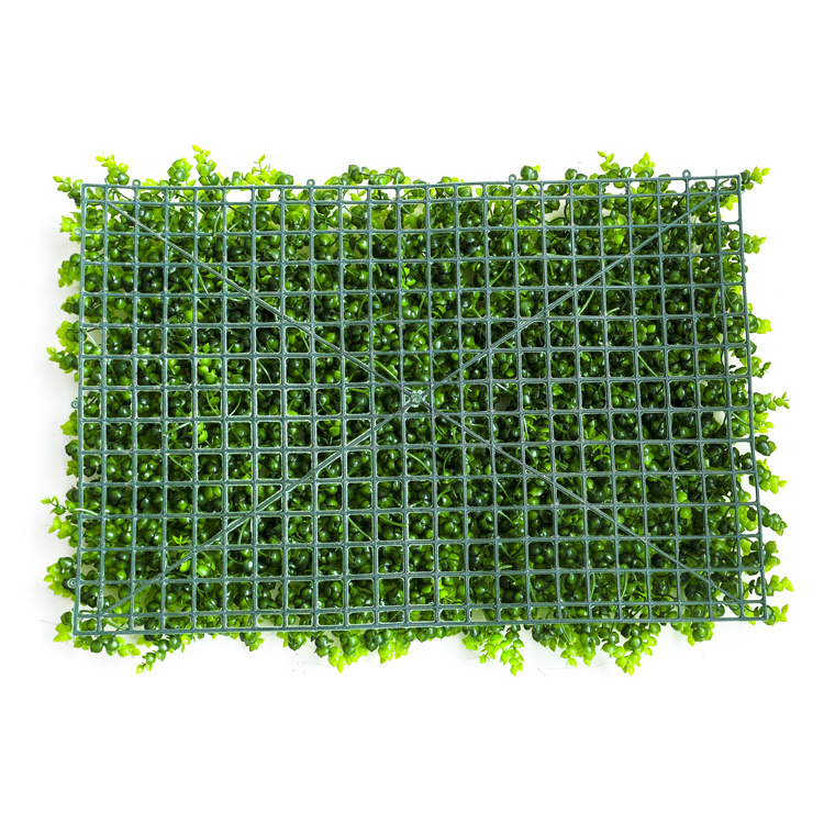 Artificial green grass wall panels background