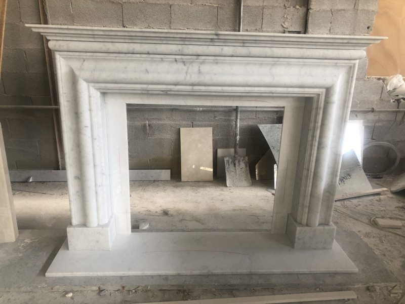 Carrara white marble fireplace surround with bolection style