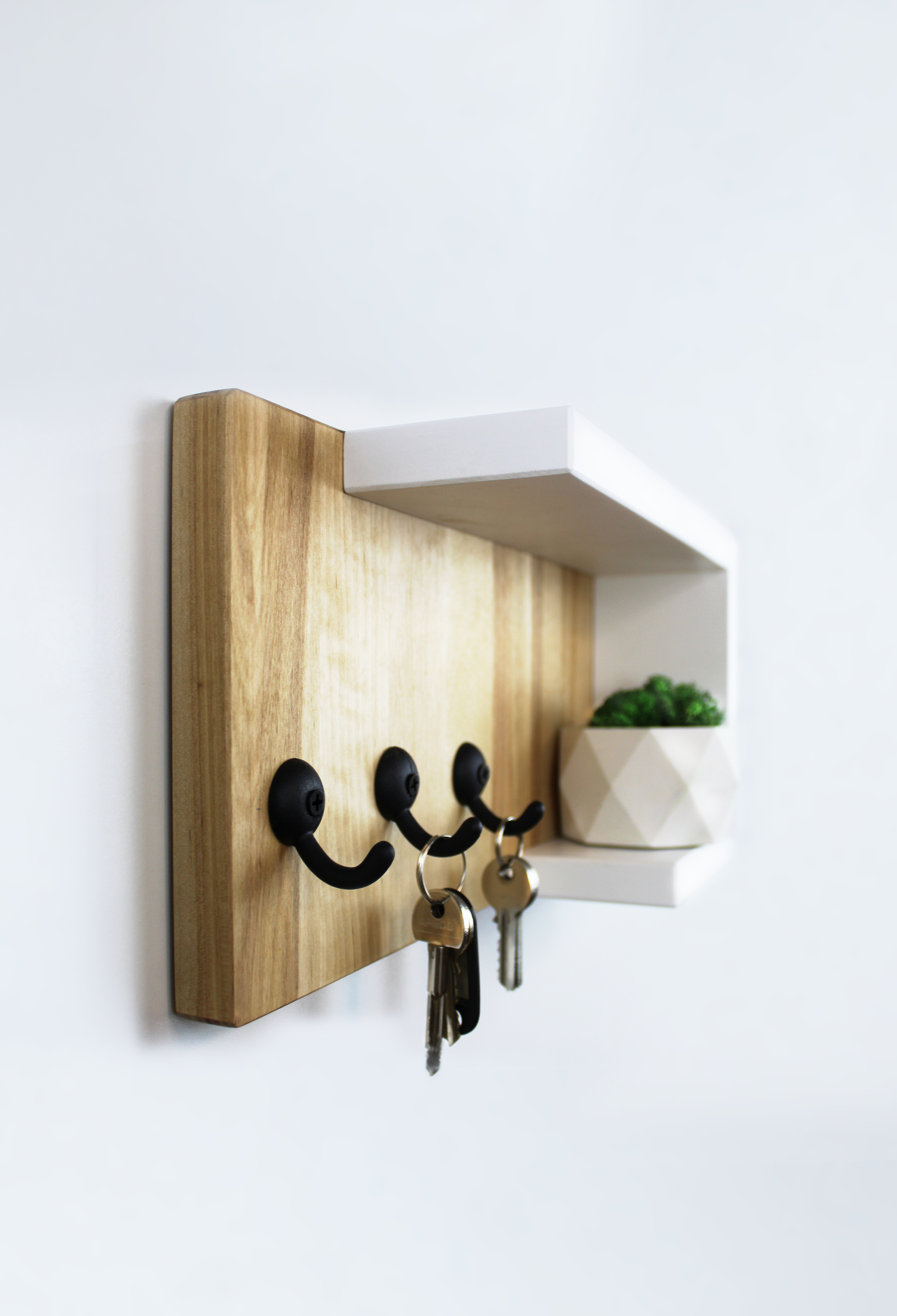 Wall mounted key holder for the hallway white with a wooden shelf organizer hanging and storage for home