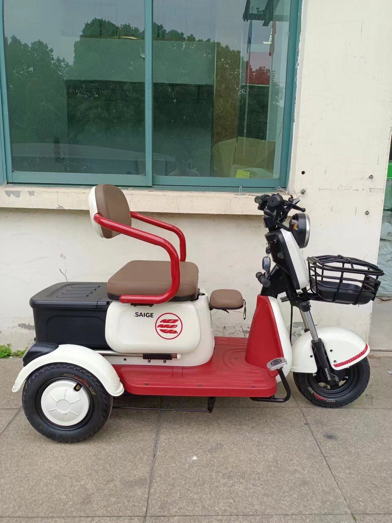 Three people ride electric tricycles for the disabled mini electric tricycle scooter for the elderly