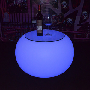 LED plastic glowing colored coffee with led lights bar illuminated outdoor table