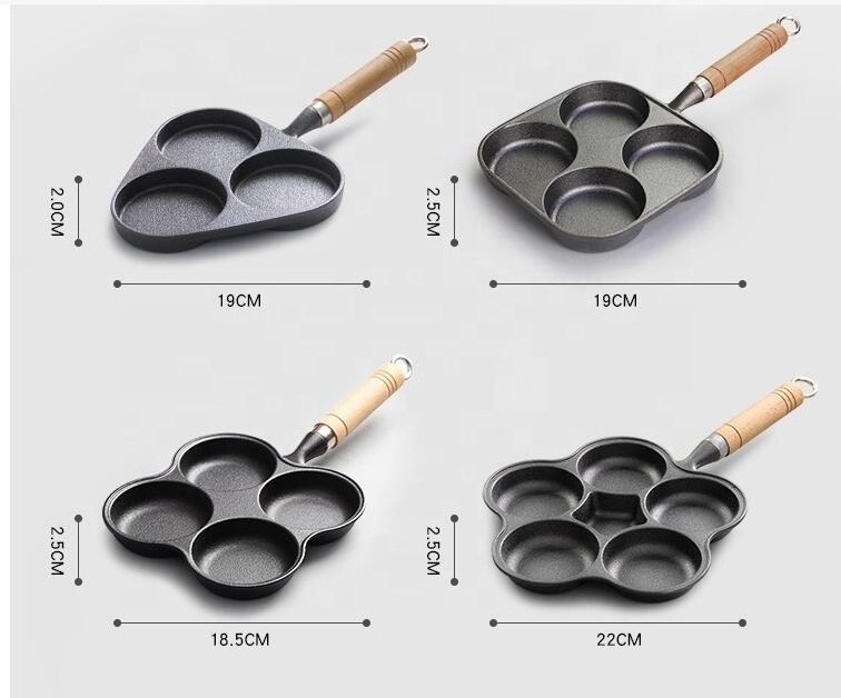 Four hole cast iron frying pan with wooden handle for cooking egg and hamburger