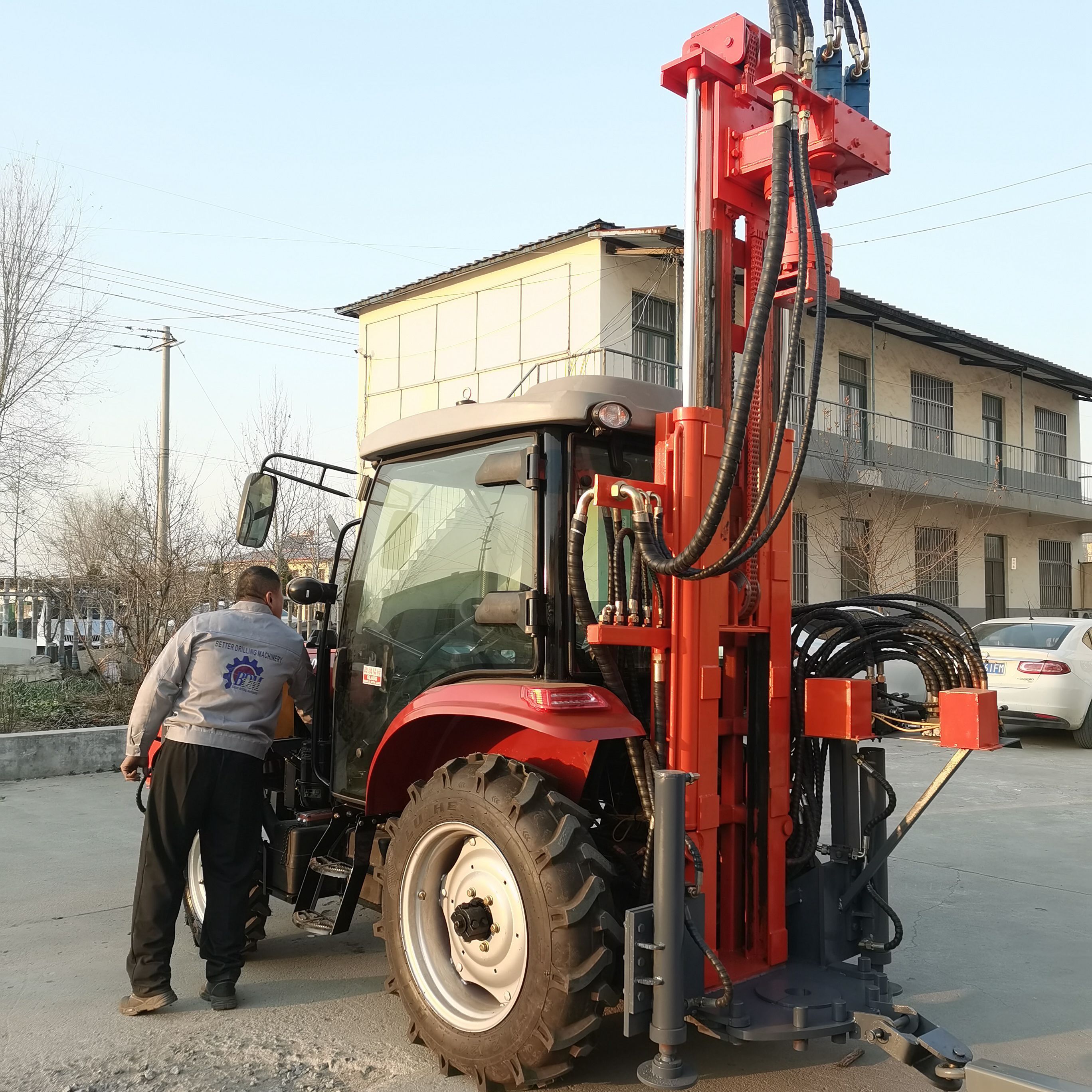 Tractor mounted air DTH water well drilling rig