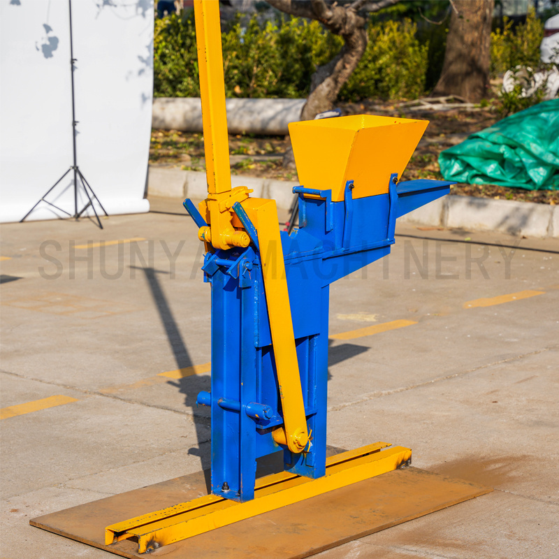 low price manual mud clay interlocking bricks making machine