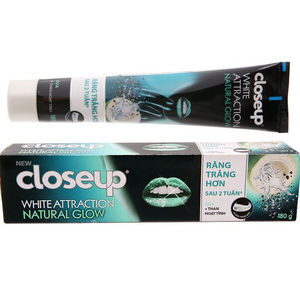 Closeup toothpaste with activated charcoal coconut teeth whitening 180g