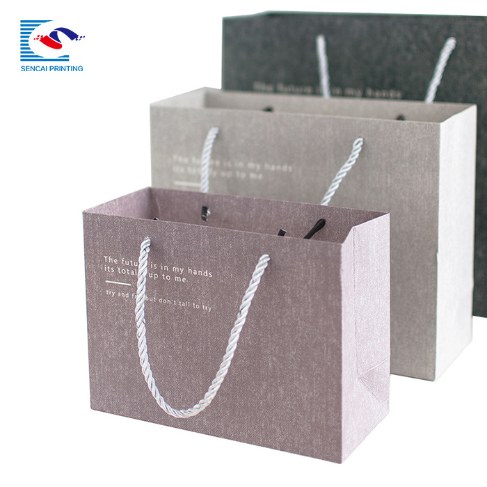 High quality custom logo garment shopping paper bag with handles