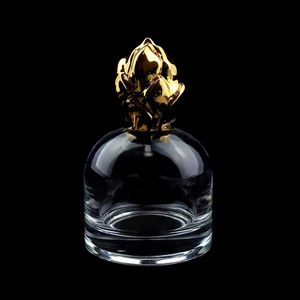 50ml luxury custom made thick bottom cylinder perfume bottle with gold zamac flower lid