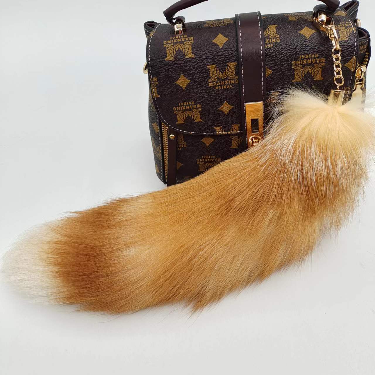 Wholesale price cheap genuine leather keychain for sale american raccoon hair tail keychain