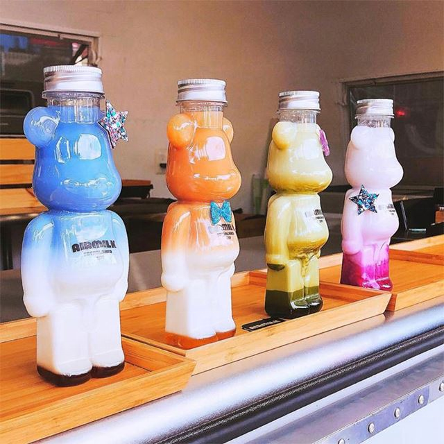 Door to Door Service 350ml 400ml 500ml 700ml Pet Plastic Bear Shape Juice Bottle for drinking with cap and straps