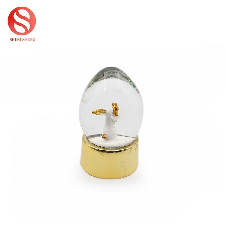 Home decoration egg shape silver golden rabbit resin easter snow globe