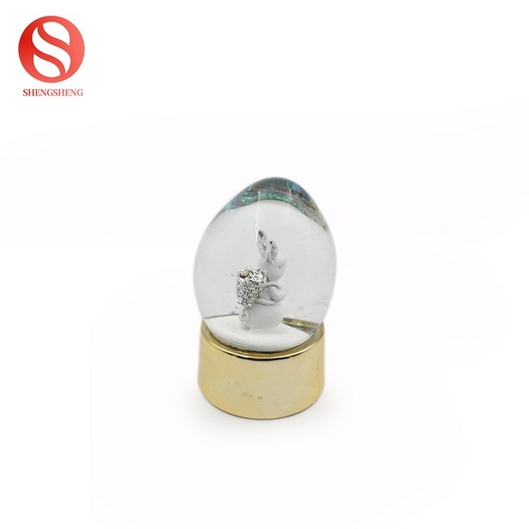 Home decoration egg shape silver golden rabbit resin easter snow globe