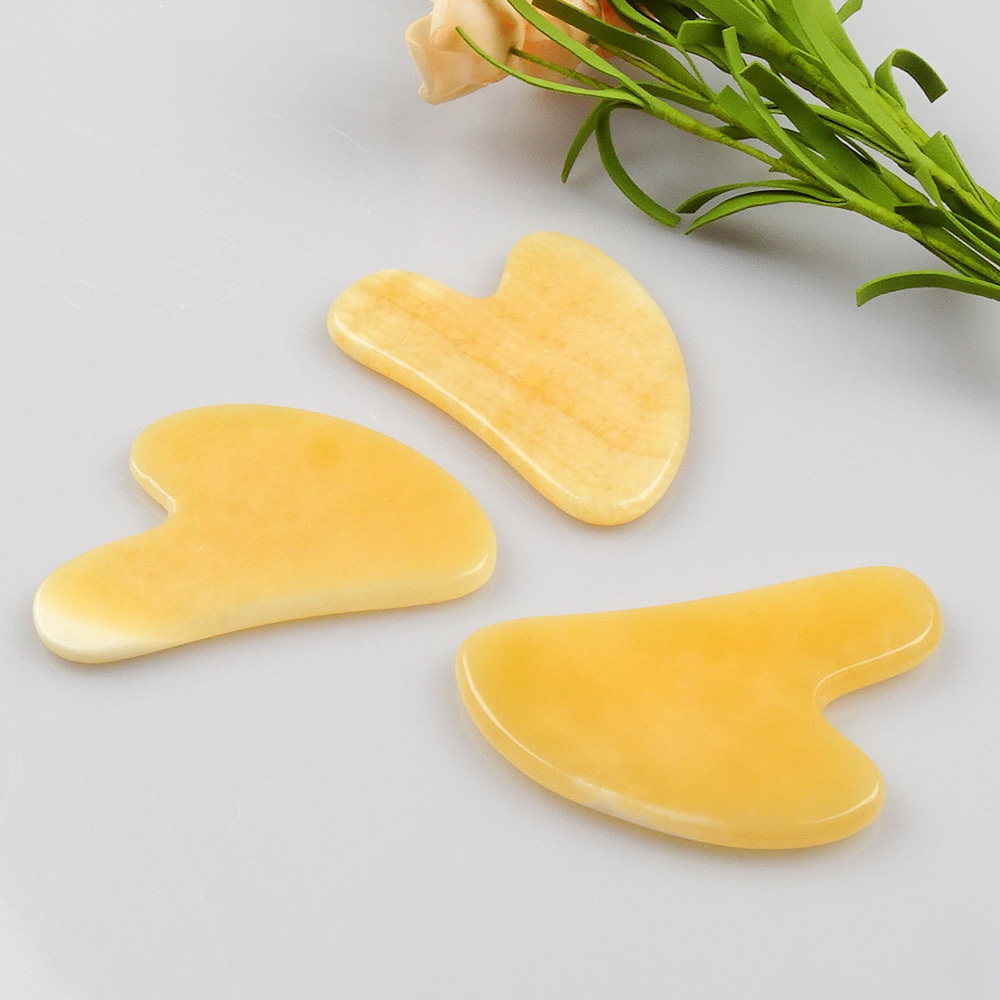 Private Label High Quality 100% Natural Yellow Crystal Jade Stone Orange Color Gua Sha For Facial Massage