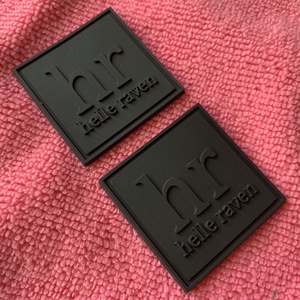 Trademark logo solid black rubber label,eco-friendly embossed logo silicone rubber bag tags