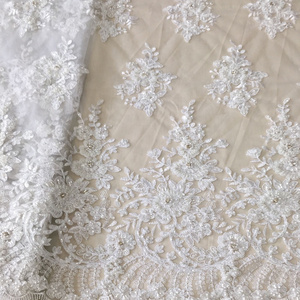 beautiful white wedding dress lace fabric with heavy handwork shining sequins beaded rhinestones embroidery cord lace fabric