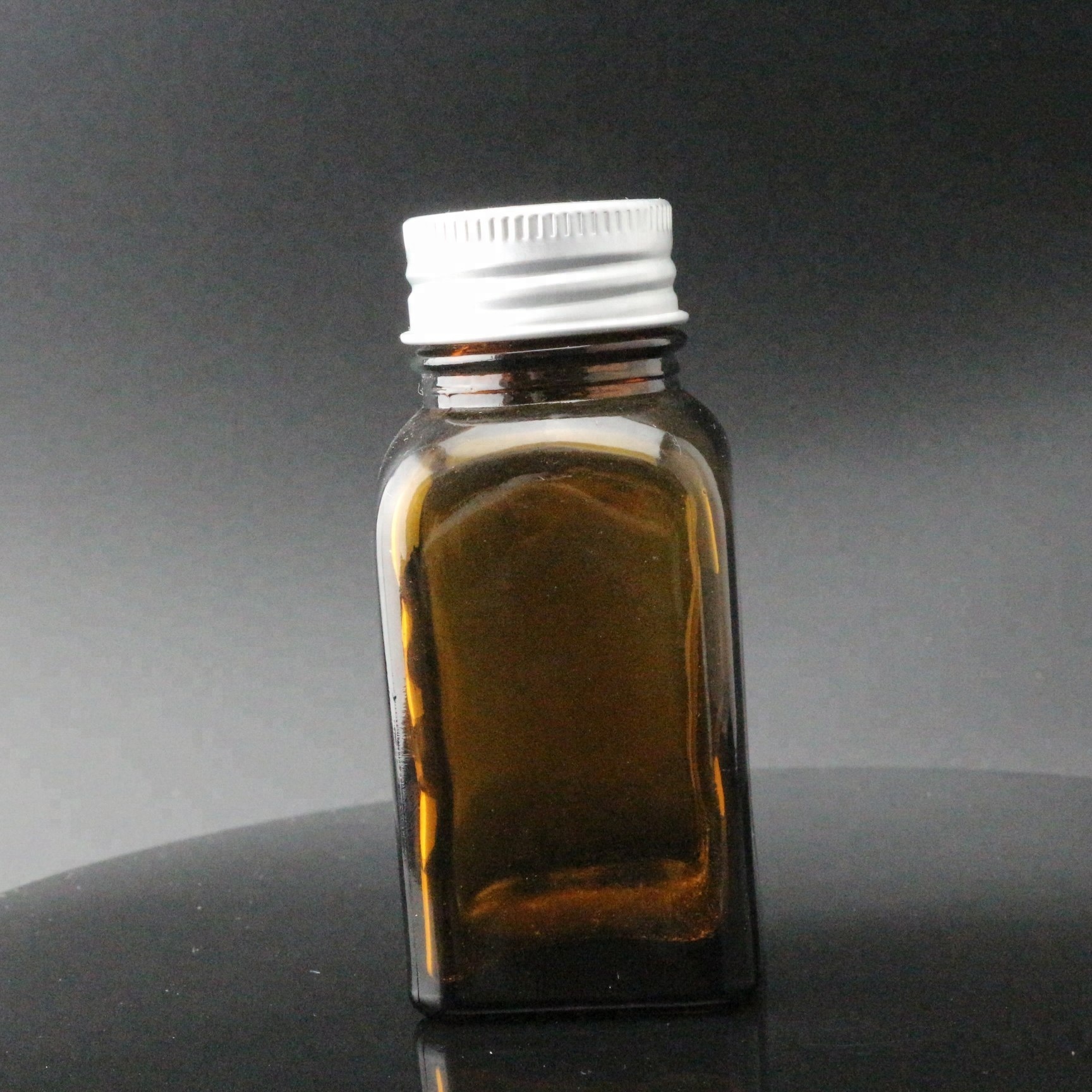 Wholesale  amber french square glass bottle with Black Cap