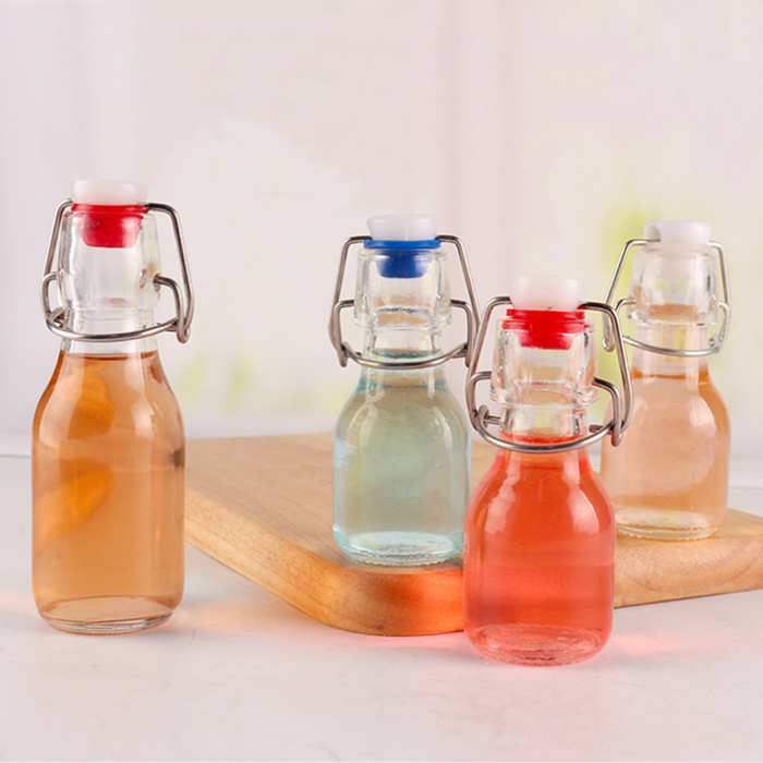 Wholesale swing top glass bottle mini glass empty wine bottle 60ml 100ml buckle glass sealed bottle