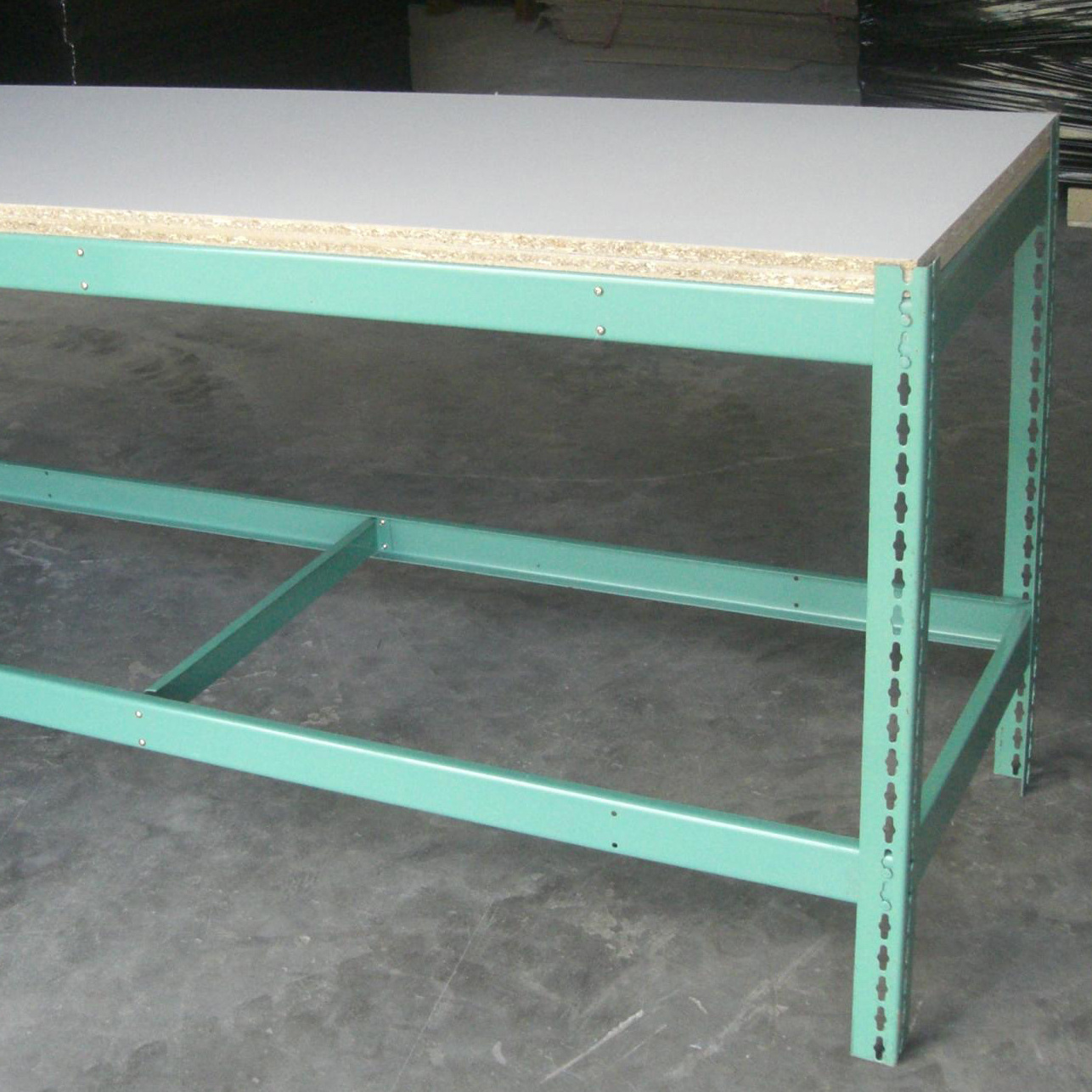 Rivet boltless racking and shelving to produce work table lower desk with wood shelves on top and boltless racking shelf