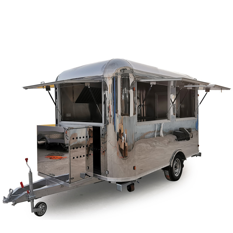 Airstream  bus catering trailer, mobile kitchen camping caravan trailer, popcorn pizza fried food truck on the street