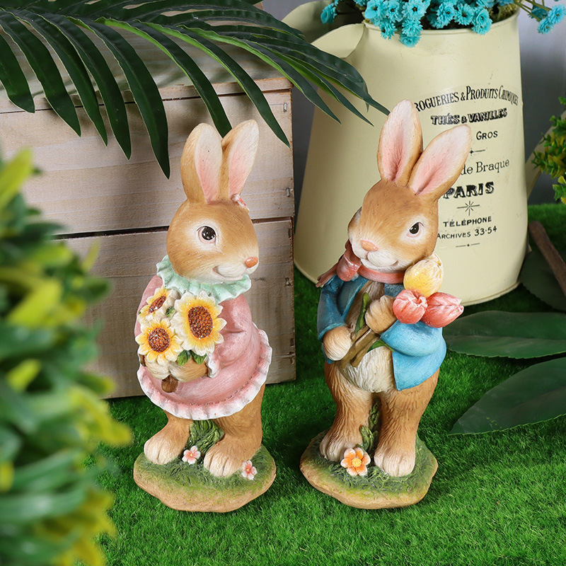 Easter resin rabbit statue decoration in the forest picking flowers to transport eggs a group of cute rabbits