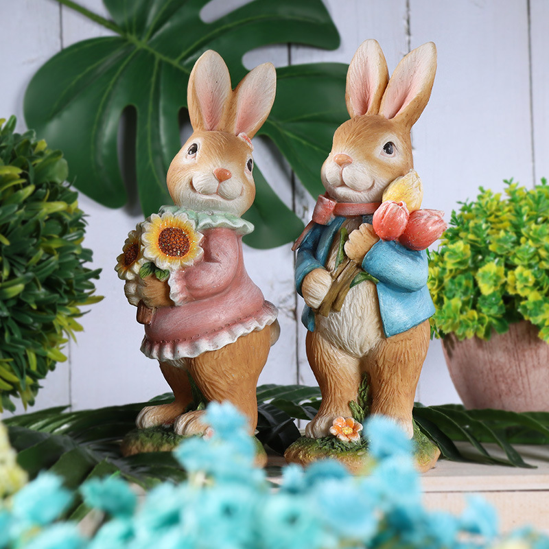 Easter resin rabbit statue decoration in the forest picking flowers to transport eggs a group of cute rabbits