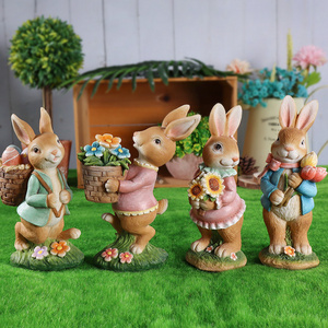 Easter resin rabbit statue decoration in the forest picking flowers to transport eggs a group of cute rabbits