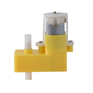 Yellow dc gear motor with plastic wheels of toy car