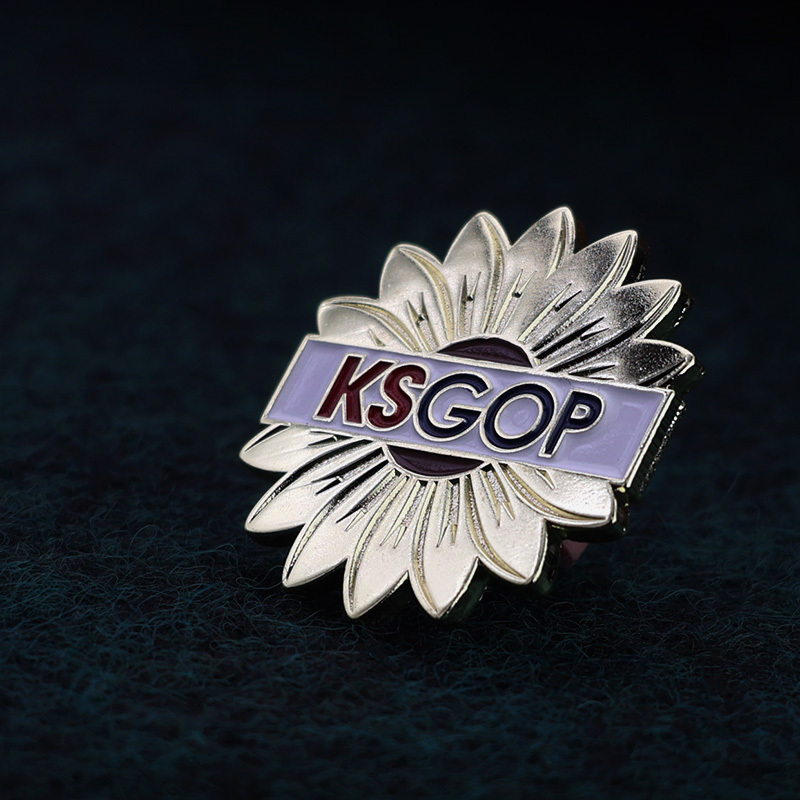 Metal flower with KSGOP letters lapel pin