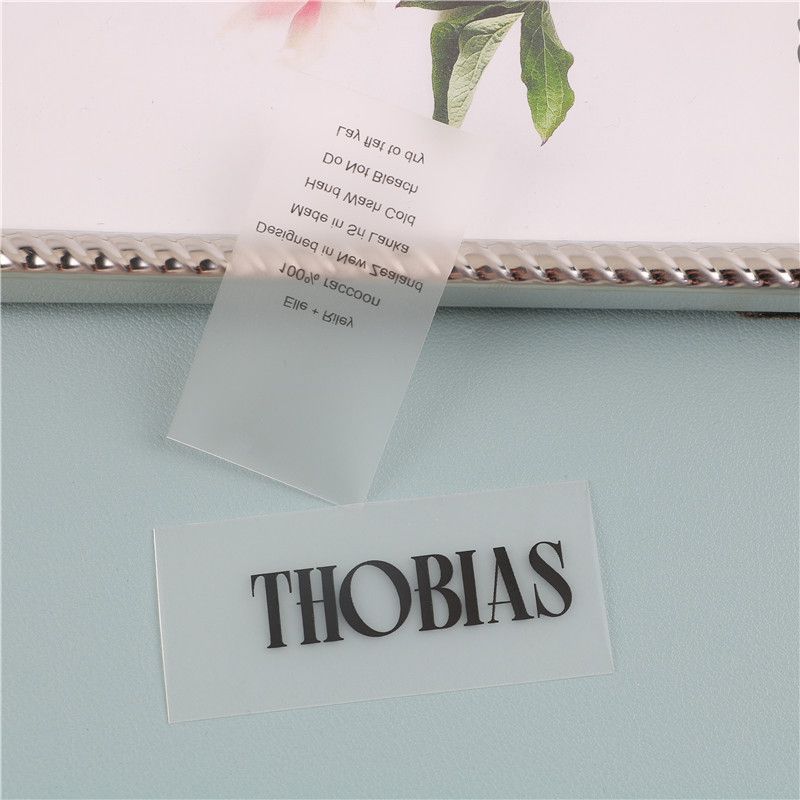 Custom heat transfer embossed tpu patch label logo, tpu care label roll