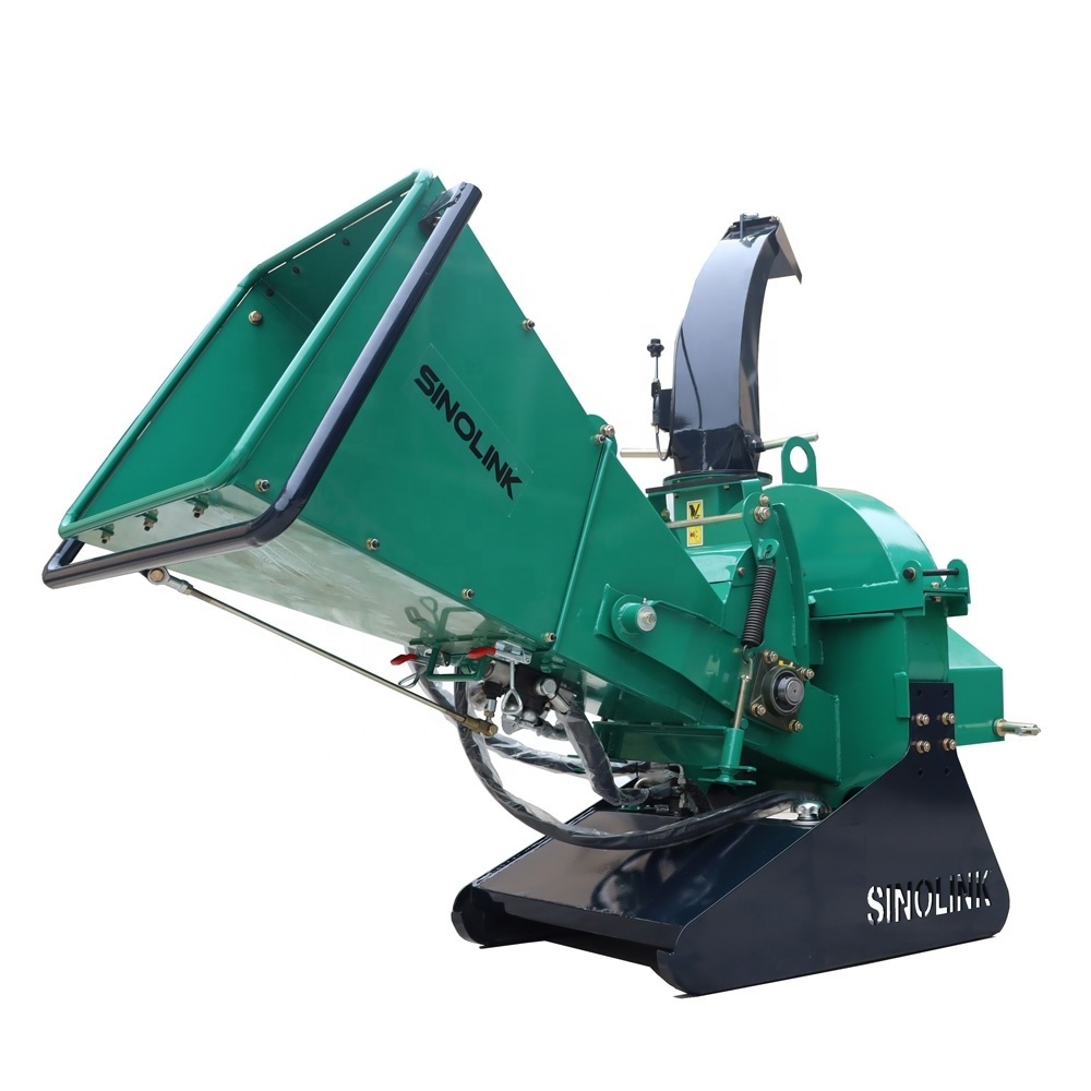 Wood crusher / tractor with hydraulic feed system drives wood chipper