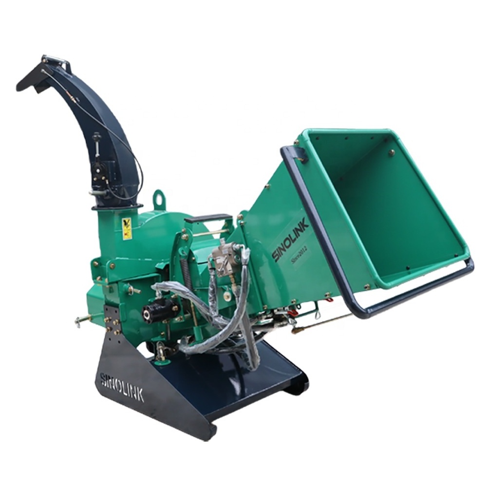 Wood crusher / tractor with hydraulic feed system drives wood chipper