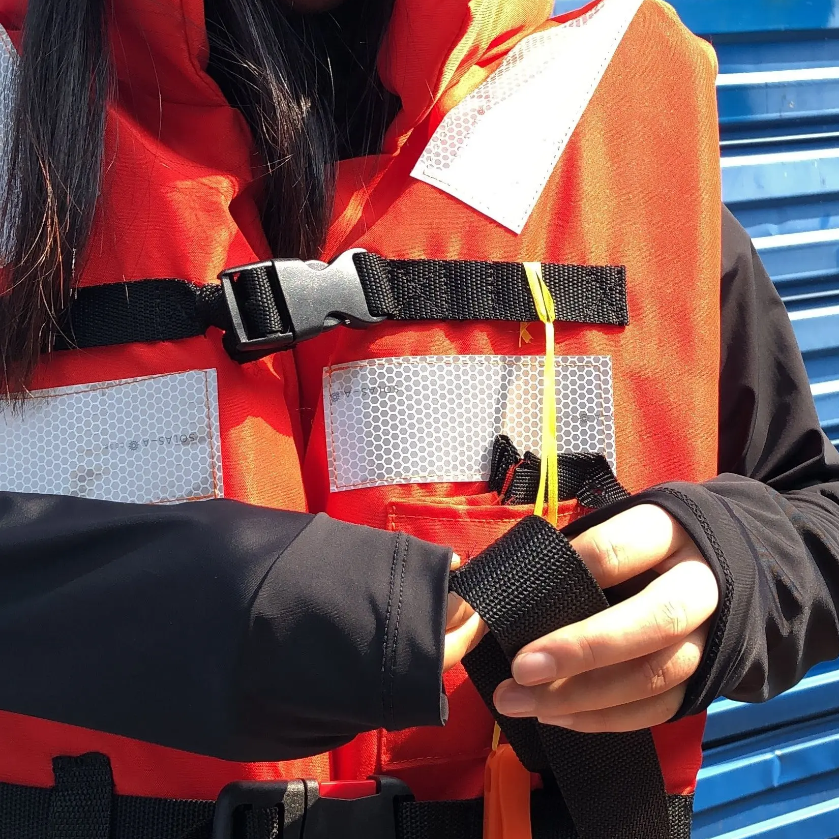 Adult marine life jackets made of polyester filled buoyancy foam with reflective strips