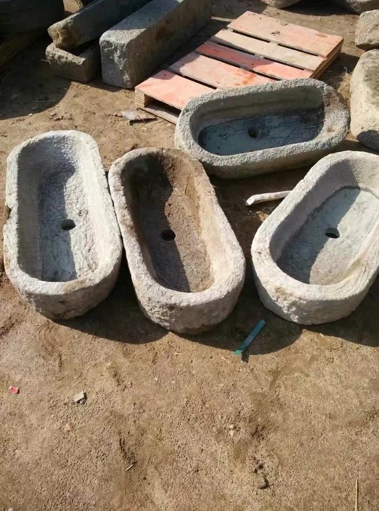 Reclaimed old stone pig feed water trough