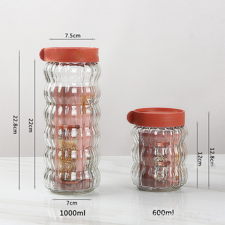 Factory price four-piece set clear glass sealed jars candy cookies food Grade storage bottles with lid