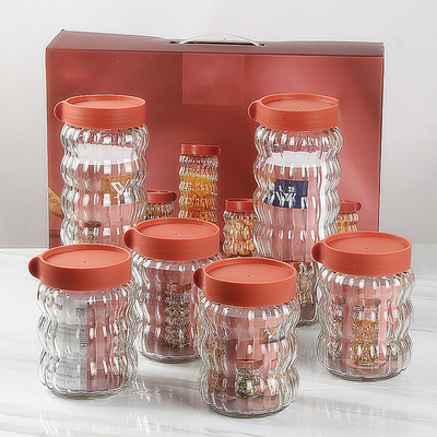 Factory price four-piece set clear glass sealed jars candy cookies food Grade storage bottles with lid