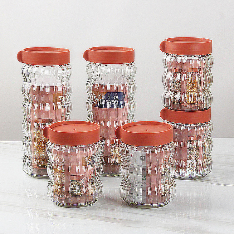 Factory price four-piece set clear glass sealed jars candy cookies food Grade storage bottles with lid