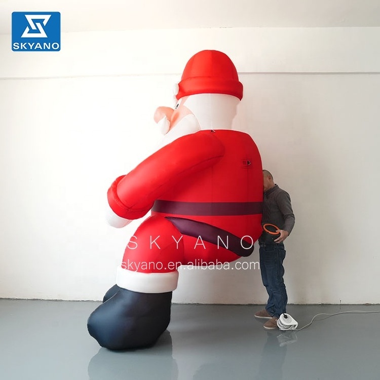 Inflatable giant Santa Claus Christmas Advertising Giant Inflatable Christmas  Santa Claus sitting on the roof for sale