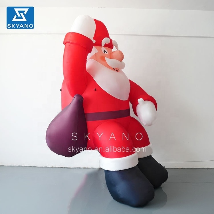 Inflatable giant Santa Claus Christmas Advertising Giant Inflatable Christmas  Santa Claus sitting on the roof for sale