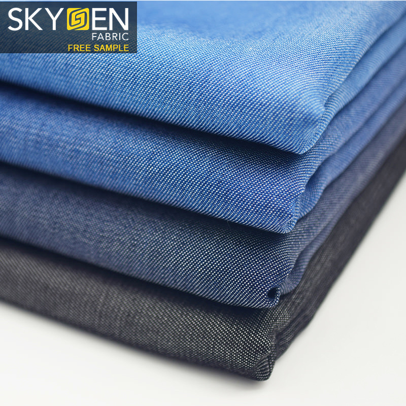 Skygen OEM jeans shirt dress wholesale solid soft woven 100% twill lyocell denim fabric for garments