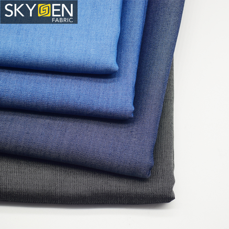 Skygen OEM jeans shirt dress wholesale solid soft woven 100% twill lyocell denim fabric for garments