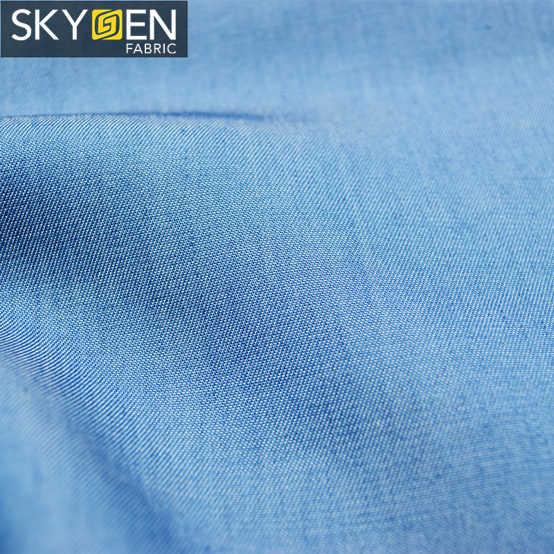 Skygen OEM jeans shirt dress wholesale solid soft woven 100% twill lyocell denim fabric for garments