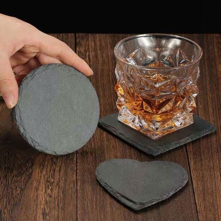 There are round food plates or cup insulation pads with extra square storage boxes black slate coaster set