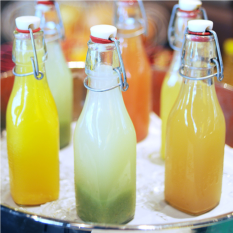 Factory Product 500ml Clear Flat Bottom Empty Glass Bottle Juice Soda Wine 16oz Kombucha Swing Top Beer Bottle with Swig Top Cap