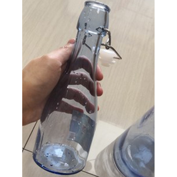 Best Selling 1000ml Clear Swing Top Embossed Round Glass Beverage Bottle for sales