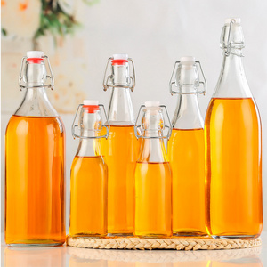 Factory Product 500ml Clear Flat Bottom Empty Glass Bottle Juice Soda Wine 16oz Kombucha Swing Top Beer Bottle with Swig Top Cap