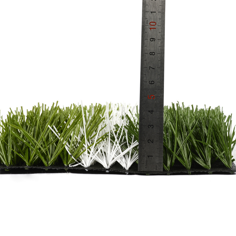 grass outside cage football field artificial turf