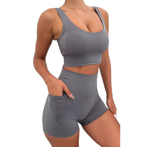 Solid color sports vest set, pocket decoration, tight fitting high waisted shorts, women's running sports two-piece set