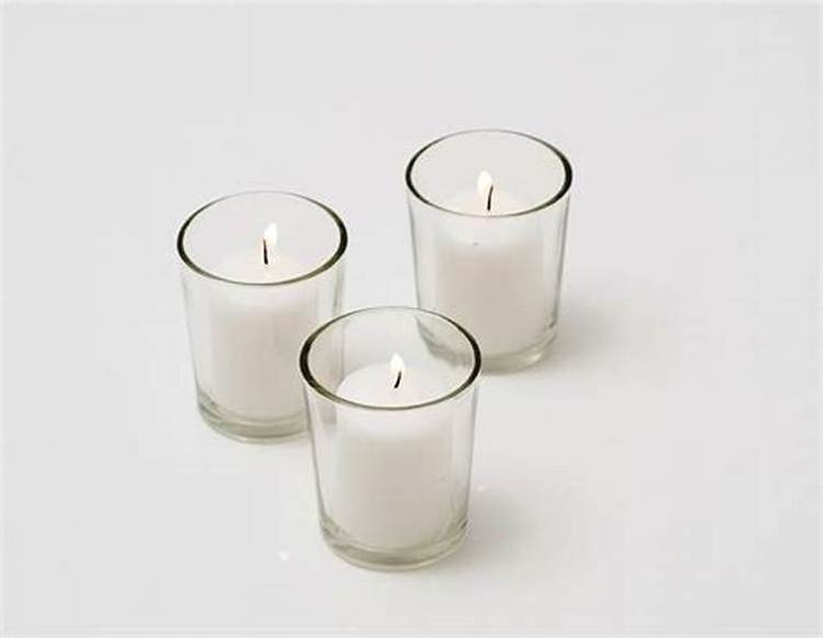 white  votive candle with clear glass jars holders