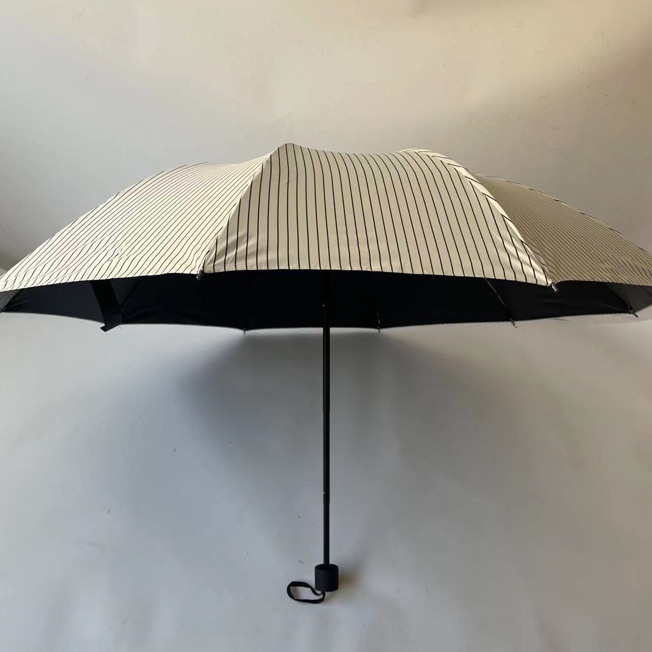 2024 Factory New 3 Fold 10K Strip Pattern Black Coated Manual Folding Uv Umbrella  Parasol Wholesale For The Rain