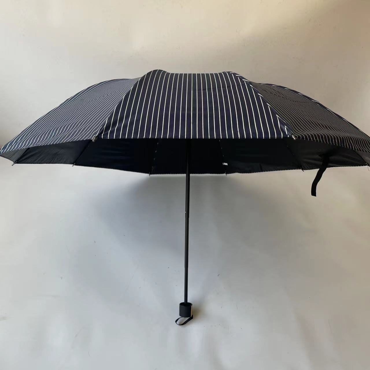 2024 Factory New 3 Fold 10K Strip Pattern Black Coated Manual Folding Uv Umbrella  Parasol Wholesale For The Rain